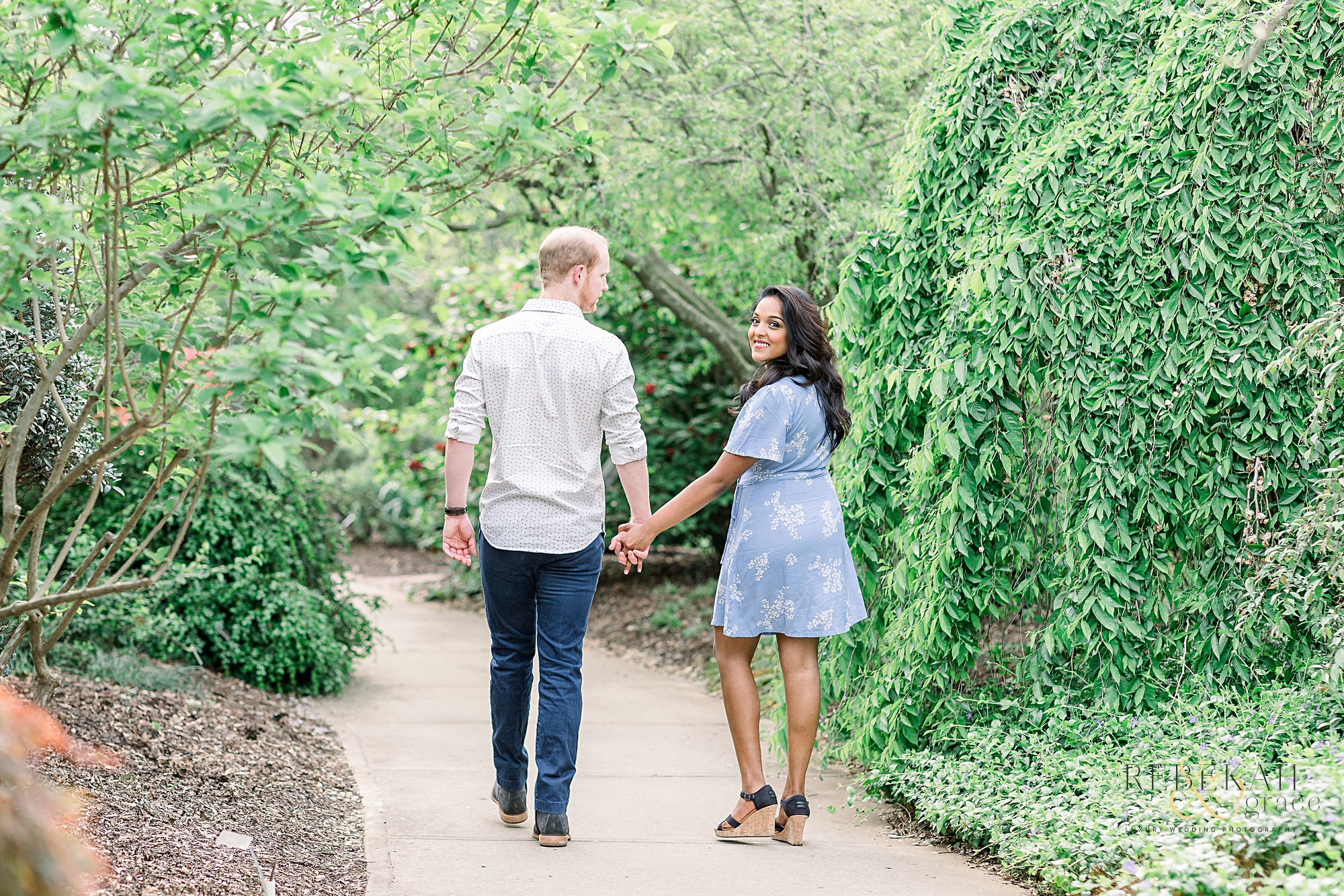 Custom gold engagement ring. Raleigh engagement photography taken at the JC Raulston Arboretum and Downtown Raleigh North Carolina. Photography by Rebekah & Grace Photography.