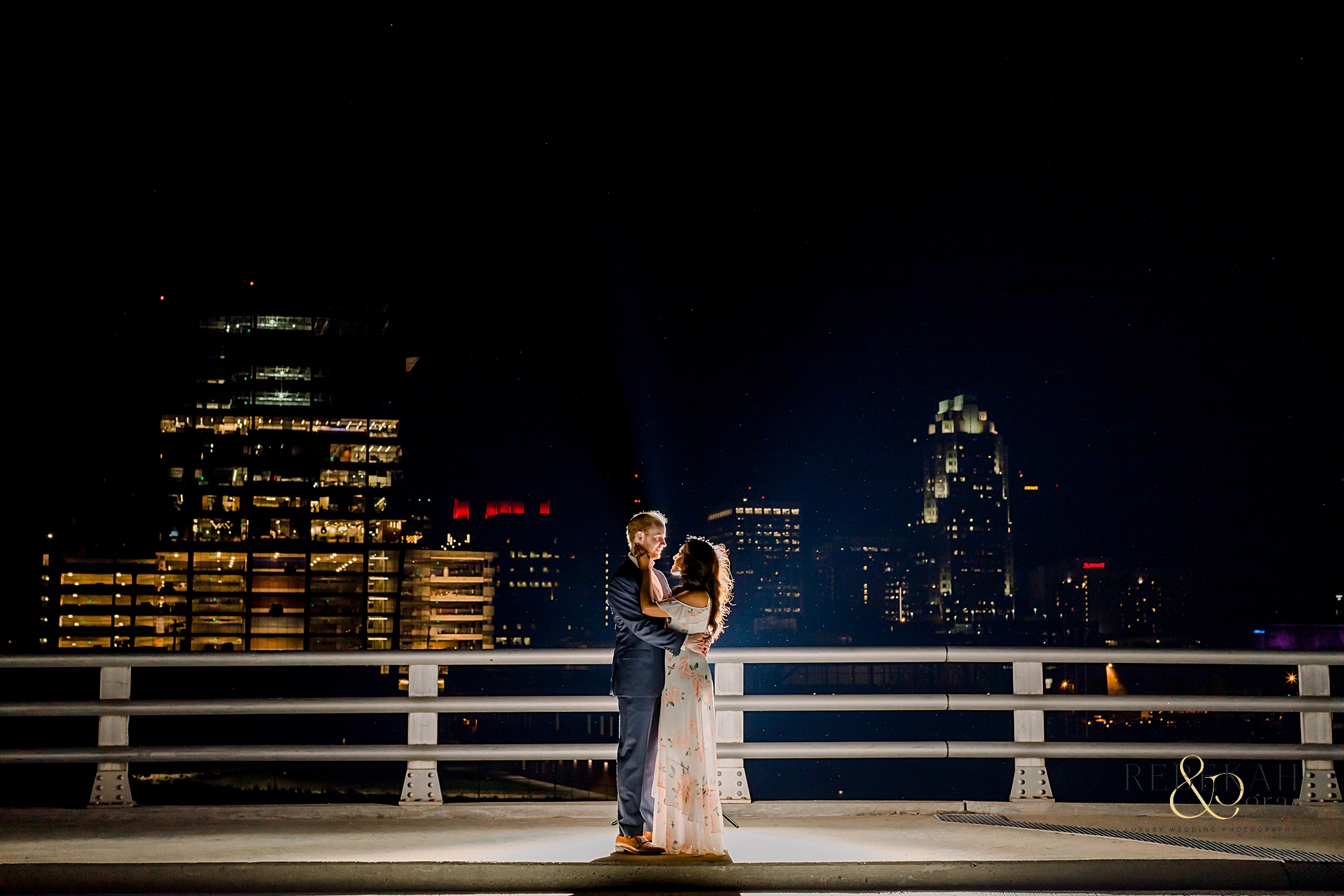 Engagement Photography | Night city lights in Downtown Raleigh, North Carolina. | Photography by Rebekah & Grace Photography.